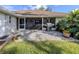 Screened patio with outdoor grill and lush green lawn at 343 Woodvale Dr, Venice, FL 34293