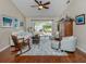 Spacious living room featuring hardwood floors, a ceiling fan and access to a back patio at 343 Woodvale Dr, Venice, FL 34293