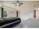 Large bedroom with two beds, ceiling fan and backyard view at 3524 Brownwood Ter, North Port, FL 34286