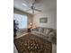 Living area with sofa, rug, and ceiling fan at 4215 Vicenza Dr # D1, Venice, FL 34293