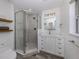 Beautiful bathroom featuring an glass enclosed shower, tile, modern vanity and fixtures at 510 Harbor S Dr, Venice, FL 34285