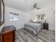 Bedroom with natural light and vinyl wood-look flooring at 510 Harbor S Dr, Venice, FL 34285