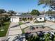Charming home with a well-manicured front yard, palm trees, and a spacious driveway at 510 Harbor S Dr, Venice, FL 34285