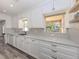 A beautifully remodeled kitchen featuring white cabinets, drawers and stainless steel appliances at 510 Harbor S Dr, Venice, FL 34285