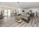 A spacious living room with a dining area, stylish floors, and modern decor at 510 Harbor S Dr, Venice, FL 34285