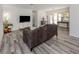 Cozy living room featuring grey wood floors, a large window and modern decor at 510 Harbor S Dr, Venice, FL 34285