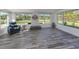 Bright sunroom features vinyl flooring and plenty of natural light at 510 Harbor S Dr, Venice, FL 34285