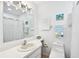 Clean bathroom with toilet, sink and shower at 6796 Gasparilla Pines Blvd # 62, Englewood, FL 34224