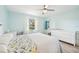 Spacious bedroom with queen bed, dresser and window at 6796 Gasparilla Pines Blvd # 62, Englewood, FL 34224