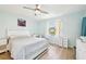 Bright bedroom with a queen-size bed and built-in desk at 6796 Gasparilla Pines Blvd # 62, Englewood, FL 34224