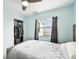 Bedroom with double bed, closet, and window overlooking backyard at 6796 Gasparilla Pines Blvd # 62, Englewood, FL 34224
