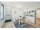 Dining room features a white table and chairs, and built-in cabinets at 6796 Gasparilla Pines Blvd # 62, Englewood, FL 34224