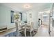 Dining area with a round white table and four chairs at 6796 Gasparilla Pines Blvd # 62, Englewood, FL 34224