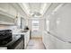 Bright kitchen features updated appliances and wood-look flooring at 6796 Gasparilla Pines Blvd # 62, Englewood, FL 34224