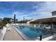 Inviting community pool with plenty of lounge chairs and a great atmosphere at 6796 Gasparilla Pines Blvd # 62, Englewood, FL 34224