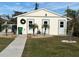Private storage unit with double doors and a nicely landscaped exterior at 6796 Gasparilla Pines Blvd # 62, Englewood, FL 34224