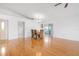 Dining room features hardwood floors and sliding glass doors to patio at 714 Brightside Crescent Dr # 8, Venice, FL 34293