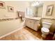 Clean bathroom with a vanity, toilet, and tiled flooring at 7339 Cameo Cir, North Port, FL 34291