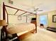 Spacious bedroom with a canopy bed and ample natural light at 7339 Cameo Cir, North Port, FL 34291