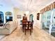 Classic dining room with wood table and chairs, access to patio at 7339 Cameo Cir, North Port, FL 34291