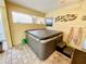 Relax in this covered patio hot tub, complete with steps and cover at 7339 Cameo Cir, North Port, FL 34291