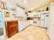 Well-equipped kitchen featuring white cabinets and tile flooring at 7339 Cameo Cir, North Port, FL 34291