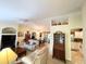 Open living room with neutral colors and view to kitchen and dining area at 7339 Cameo Cir, North Port, FL 34291
