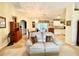 Light and airy living room with a comfortable couch and views to kitchen and dining areas at 7339 Cameo Cir, North Port, FL 34291