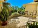 Brick paved patio area with seating for two and potted plants at 7339 Cameo Cir, North Port, FL 34291