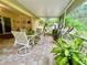 Relaxing screened patio with outdoor furniture and lush plants at 7339 Cameo Cir, North Port, FL 34291