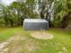 Large storage shed in backyard with grassy area at 7339 Cameo Cir, North Port, FL 34291