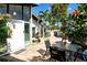 Relaxing courtyard with patio furniture, tropical plants, and access to the home at 784 Sarabay Rd # 18, Osprey, FL 34229