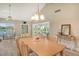 Spacious dining room with an adjacent dining area and hardwood flooring perfect for Gathering gatherings at 784 Sarabay Rd # 18, Osprey, FL 34229