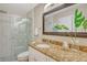 Bathroom with walk-in shower and granite countertop at 784 Sarabay Rd # 18, Osprey, FL 34229