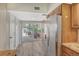 Bright kitchen features stainless steel appliances and sliding doors to the outdoor living space at 784 Sarabay Rd # 18, Osprey, FL 34229