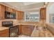 Modern kitchen with stainless steel appliances, granite countertops, and ample cabinet space at 784 Sarabay Rd # 18, Osprey, FL 34229