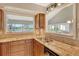 Modern kitchen with granite countertops, stainless steel sink, and ample lighting at 784 Sarabay Rd # 18, Osprey, FL 34229