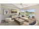 Bright living room featuring a view, vaulted ceilings, decor, and stylish furniture at 784 Sarabay Rd # 18, Osprey, FL 34229