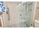 Walk-in shower with marble tile and hexagon floor at 784 Sarabay Rd # 18, Osprey, FL 34229