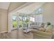 Relaxing living room with vaulted ceiling,water views, and ample natural light at 784 Sarabay Rd # 18, Osprey, FL 34229