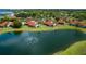 Aerial view of a condo community near a pond, featuring a red-roofed home at 784 Sarabay Rd # 18, Osprey, FL 34229