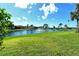 Waterfront backyard with fountain and lush landscaping at 784 Sarabay Rd # 18, Osprey, FL 34229