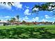 Community pool and lake view at 784 Sarabay Rd # 18, Osprey, FL 34229