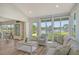 Living room with vaulted ceiling, water views and comfortable seating at 784 Sarabay Rd # 18, Osprey, FL 34229