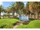 Venice Beach access sign, landscaping, and palm trees at 815 Montrose Dr # 103, Venice, FL 34293