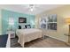 Comfortable bedroom featuring a queen-sized bed, wood floors, and ample natural light at 815 Montrose Dr # 103, Venice, FL 34293