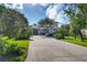 Paved driveway and well-maintained landscaping provide ample parking and curb appeal at 815 Montrose Dr # 103, Venice, FL 34293