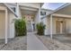 Inviting condo building entrance with stairs and covered parking at 815 Montrose Dr # 103, Venice, FL 34293
