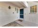 Inviting front entryway with decorative windows, a modern screen door, and a welcoming door mat at 815 Montrose Dr # 103, Venice, FL 34293