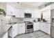 A modern kitchen boasts stainless steel appliances and elegant granite countertops at 815 Montrose Dr # 103, Venice, FL 34293